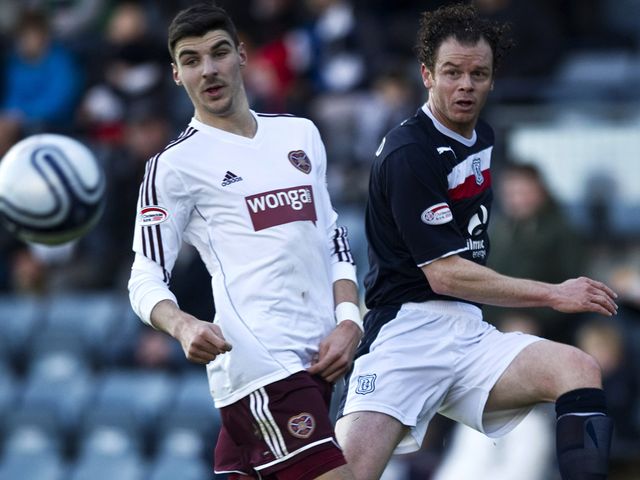 Matt Lockwood is challenged by Callum Paterson