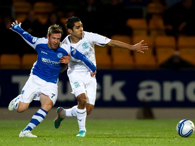 Chris Millar and Jorge Claros battle for the ball