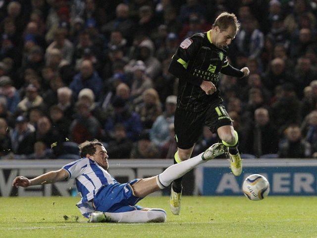 Greer tackles Varney.