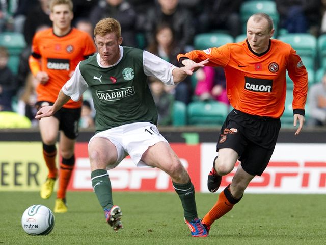 Eoin Doyle holds off Willo Flood