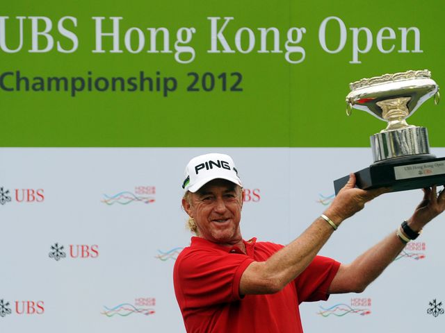 Miguel Angel Jimenez celebrates with his trophy.