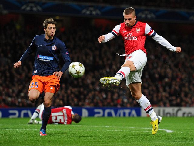 Lukas Podolski scores for Arsenal