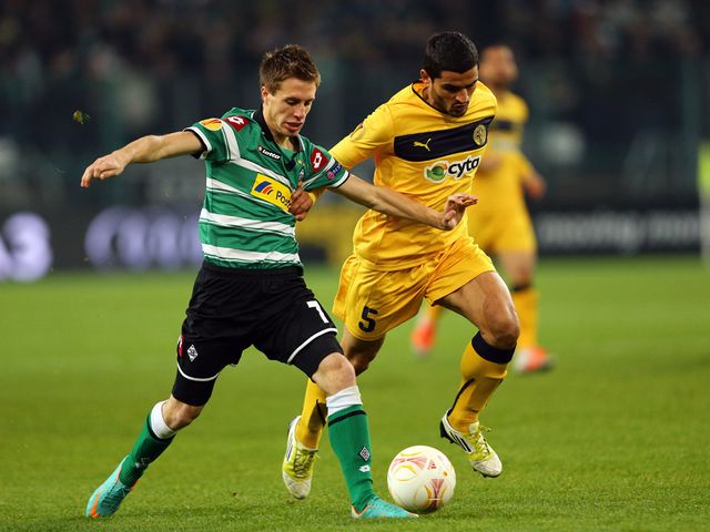 Patrick Herrmann and Stelios Parpas battle for the ball