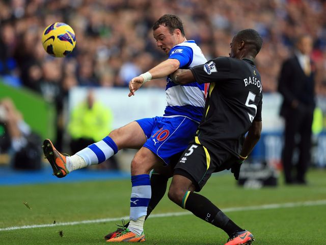 Noel Hunt and Sebastien Bassong battle for the ball