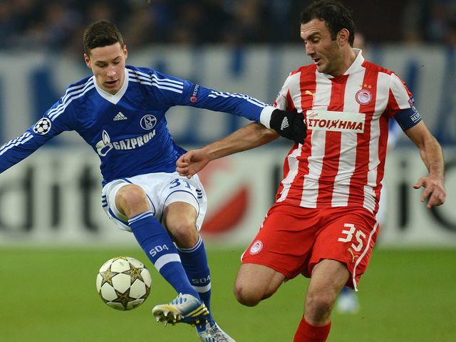 Julian Draxler battles with Vassilis Trossidis