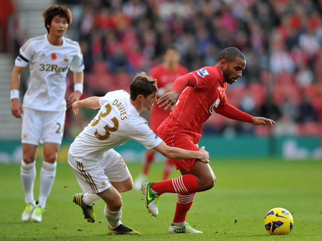 Jason Puncheon holds off Ben Davies