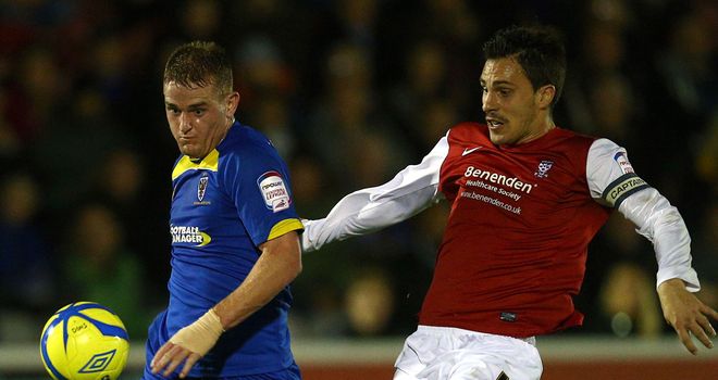 Charlie Strutton: Signs new contract with Dons