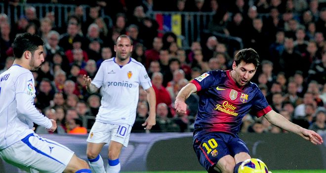 Familiar sight: Lionel Messi scores for Barca