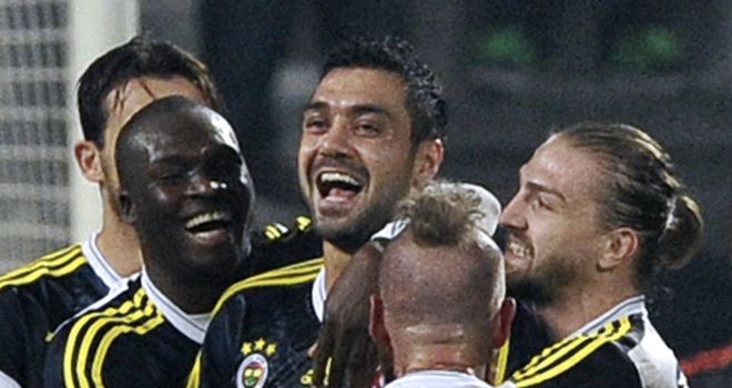 Bekir Irtegun is mobbed after scoring the winning goal for Fenerbahce