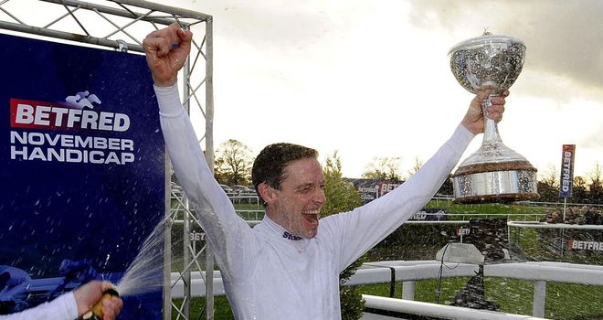 Richard Hughes: Celebrates being awarded with the jockeys' trophy