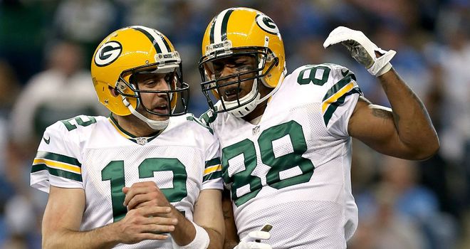 Aaron Rodgers and Jermicheal Finley celebrate a Green Bay touchdown at Ford Field