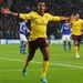 Walcott celebrates as Arsenal chase a victory that would take them back to the top of the group