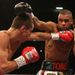 In the undercard Scott Quigg and Rendell Munroe trade blows in their super-bantamweight rematch at the Manchester Arena