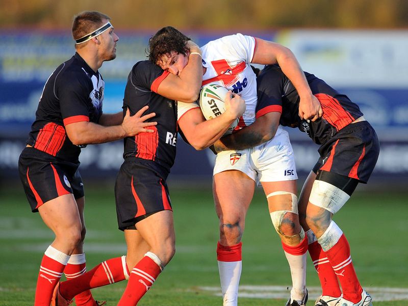 Ben Harrison is swarmed by French defenders