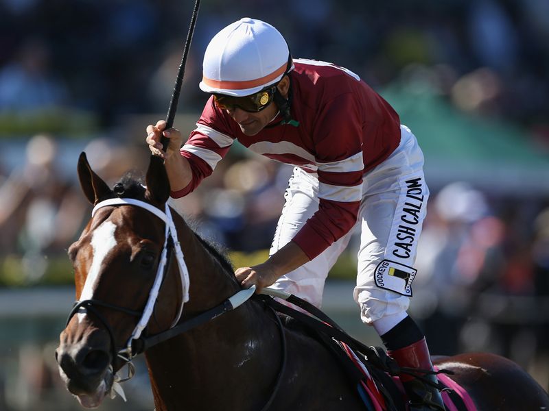 Corey Nakatani celebrates his Dirt Mile win on Tapizar