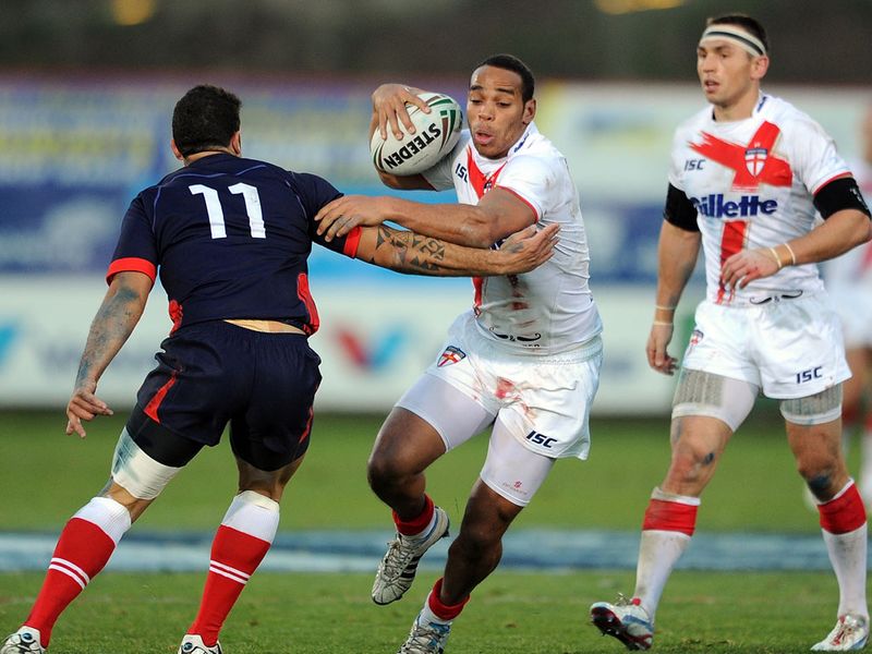 Huddersfield's Leroy Cudjoe is tackled by France's Kevin Larroyer