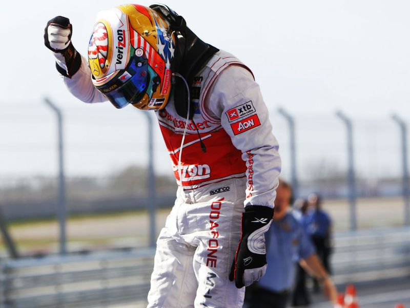 Hamilton points to the USA flag on his helmet