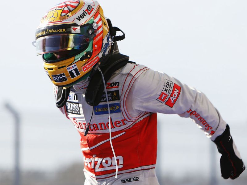 A delighted Lewis celebrates in parc ferme