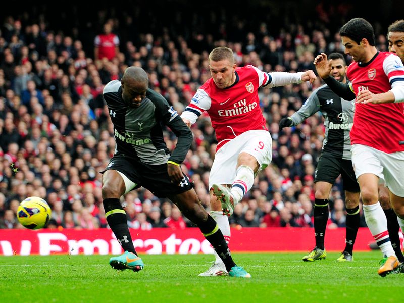 ...Lukas Podolski's blocked shot bobbles into the bottom corner on 42 minutes.
