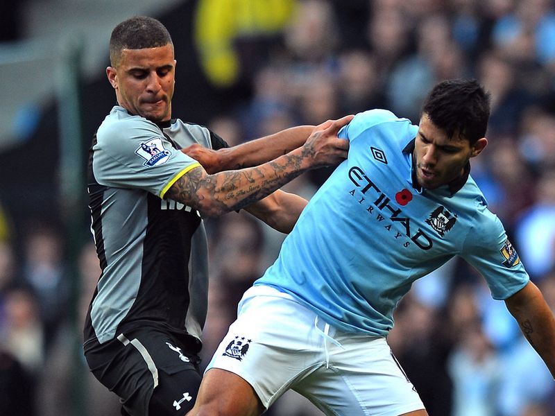 Kyle Walker battles for possession with Sergio Aguero.