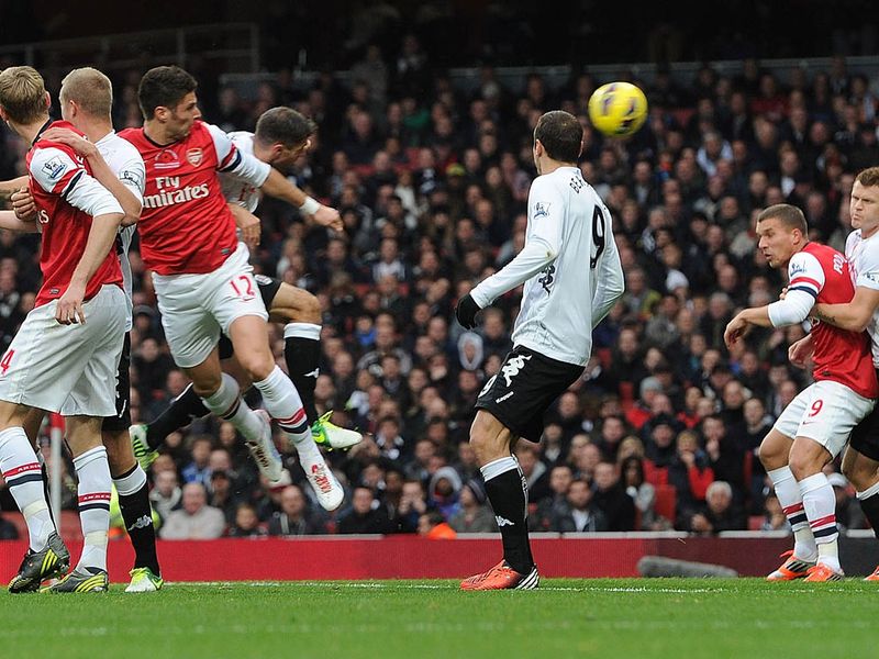 Olivier Giroud adds to his mid-week Champions League goal, heading Arsenal into the lead against Fulham from a Walcott cross.