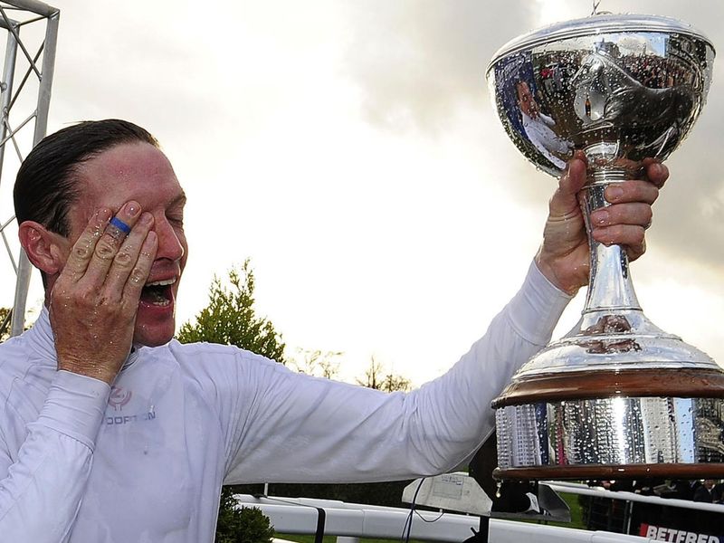 Hughes gets sprayed with champagne