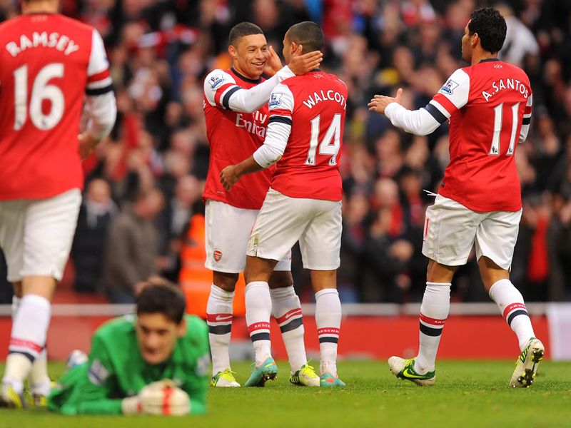 Arsenal see off some pressure from Spurs and on 91 minutes, Theo Walcott adds another goal to the tally. Square ball from Oxlade-Chamberlain sets him up...