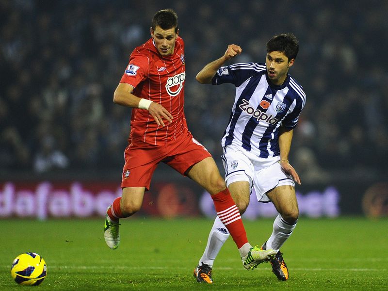 Morgan Schneiderlin holds off Claudio Yacob