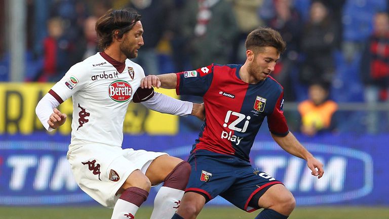 Andrea Bertolacci vies with Rolando Bianchi