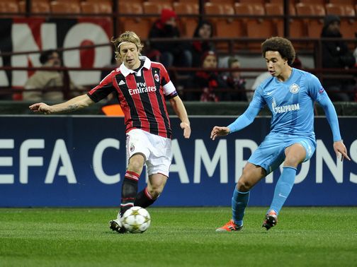 Massimo Ambrosini and Axel Witsel battle for possession
