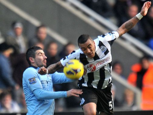 Alexandar Kolarov (left) in action at St James' Park
