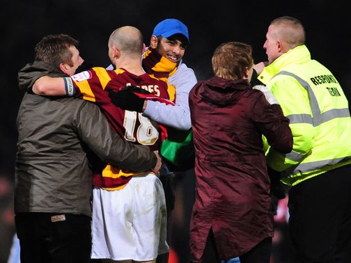 Bradford celebrate their penalties success against Arsenal
