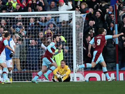 Sam Vokes races away to enjoy Burnley's equaliser.