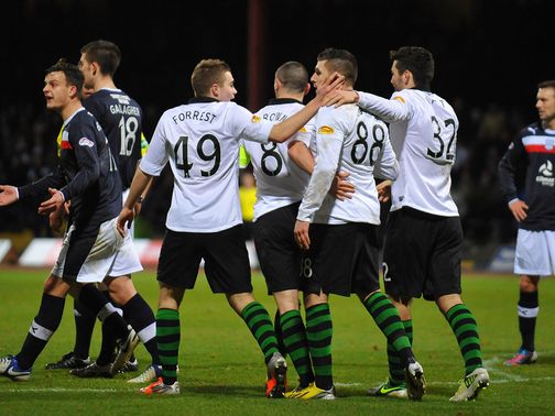 Celtic celebrate their win at Dundee
