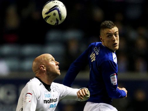 Jamie Vardy heads the ball ahead of James O'Connor