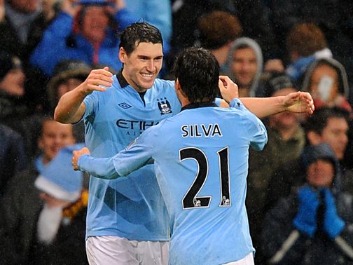 Gareth Barry celebrates his late goal