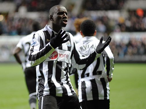Demba Ba celebrates one of his two goals v Wigan