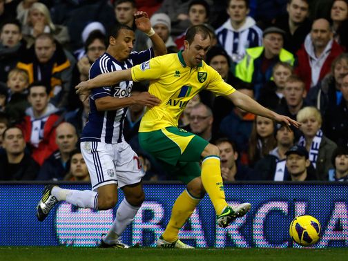 Odemwingie and Whittaker battle for the ball