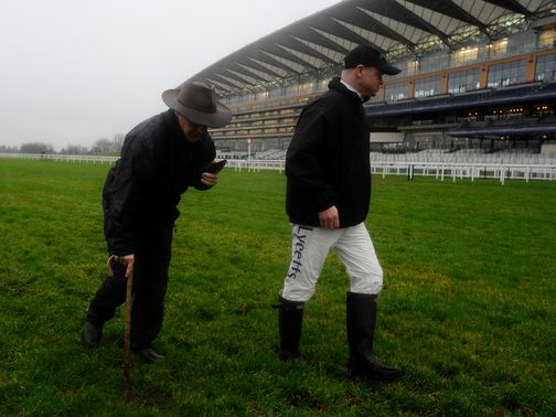 Clerk of the course Chris Stickels walks the track on Saturday