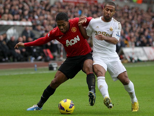 Valencia and Routledge vie for the ball