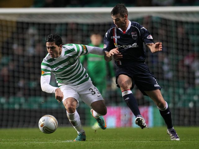 Beram Kayal and Colin McMenamin battle for the ball