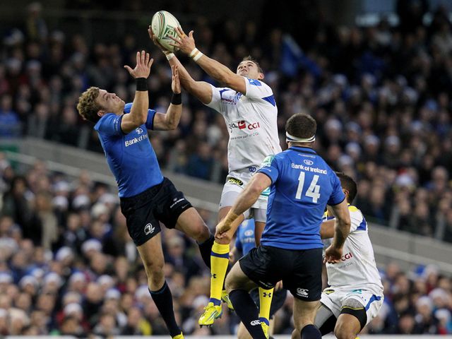 Leinster's Fergus McFadden (left) battles for possession