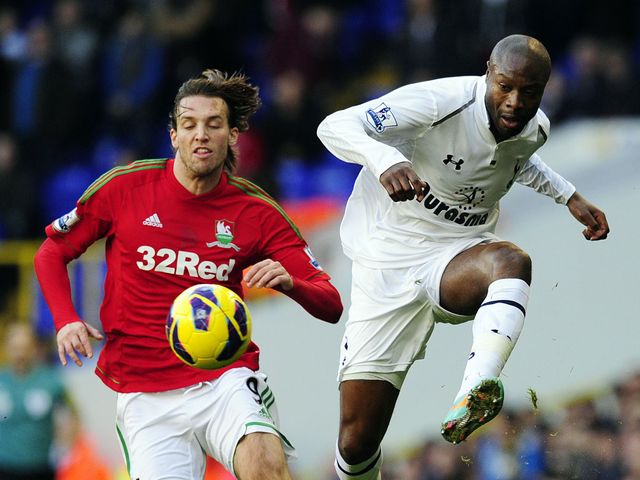 William Gallas plays away as Michu threatens