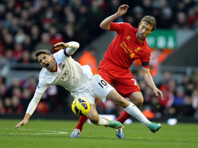 Gaston Ramirez and Lucas Leiva battle for the ball
