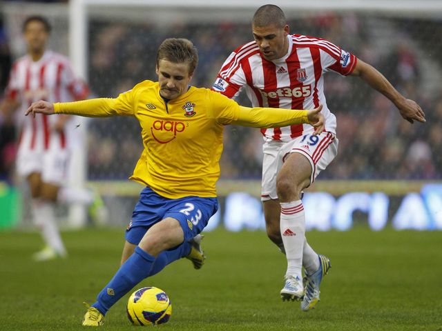 Luke Shaw holds off Jon Walters