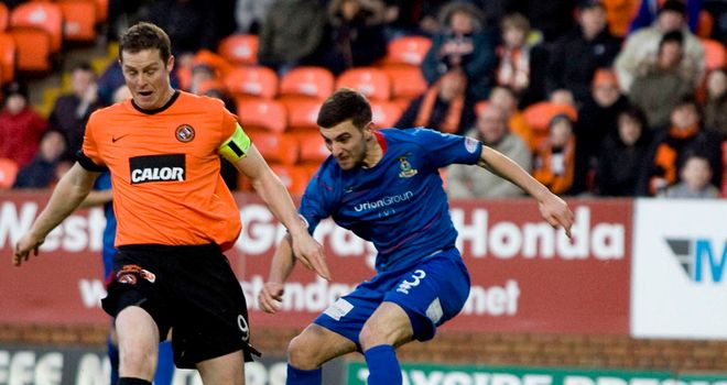 Daly and Graeme Shinnie: Battling for the ball