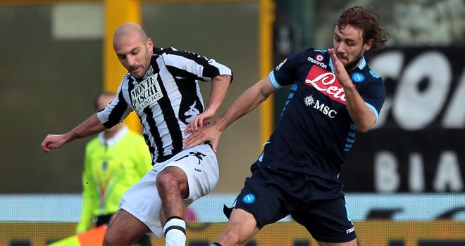 Alessandro Rosina and Marco Donadel battle for the ball