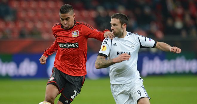 Carlinhos and Rade Prica battle for the ball