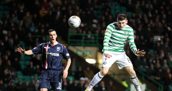 Hooper heads his second of the game at Celtic Park