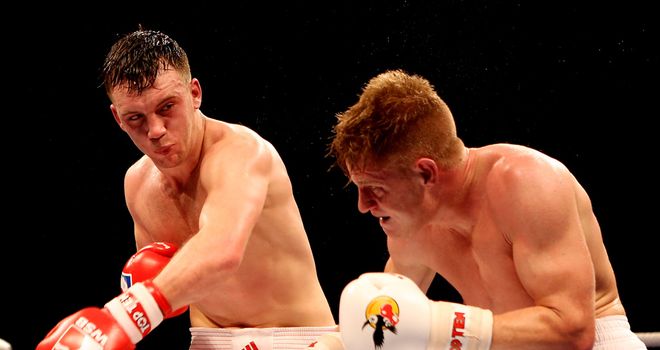 Fred Evans unleashes a heavy shot on Vjaceslav Kerber at Earls Court